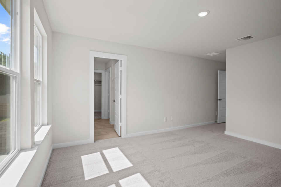 A hallway with white walls.