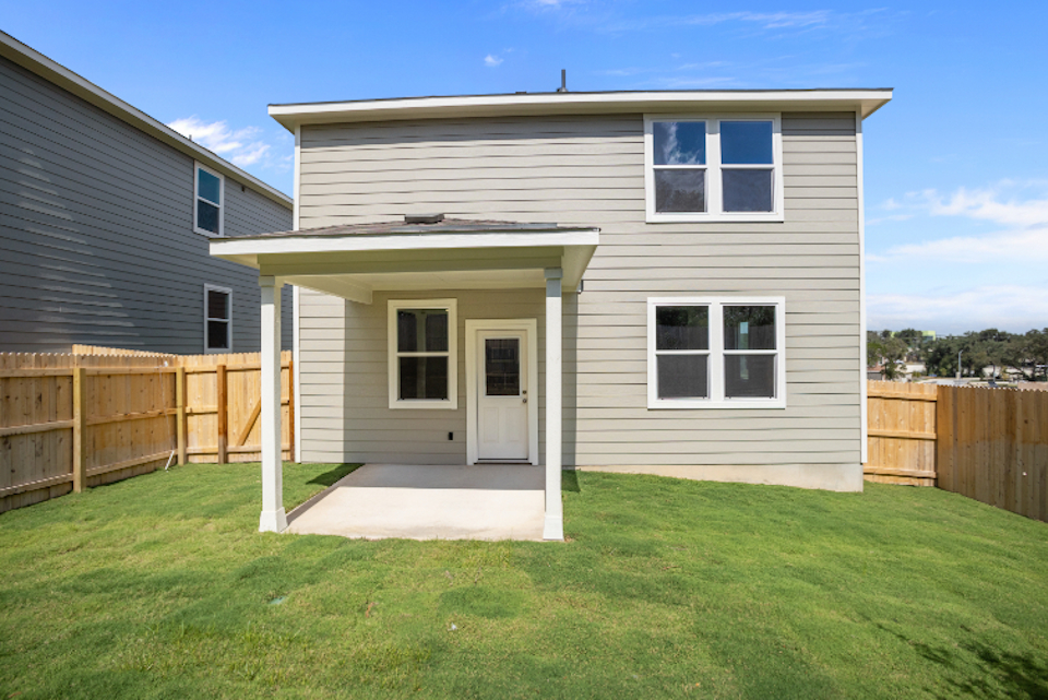 A house with a fence around it.
