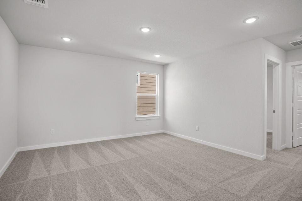 A room with a tile floor and a window.