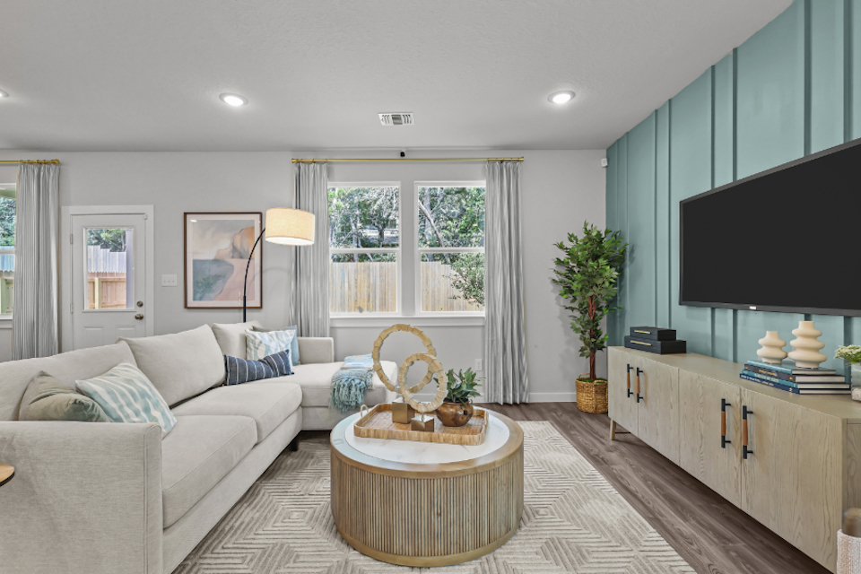 A living room with a tv and a couch.