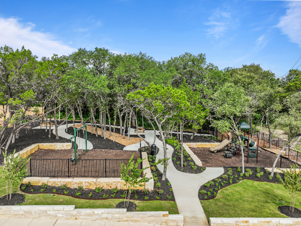 A park with trees and a playground.