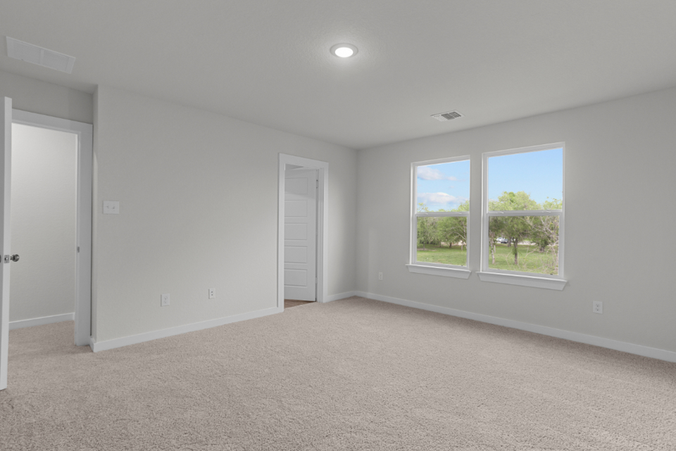 A room with a window and a door.