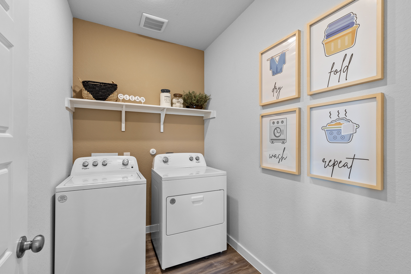 A laundry room with white walls.