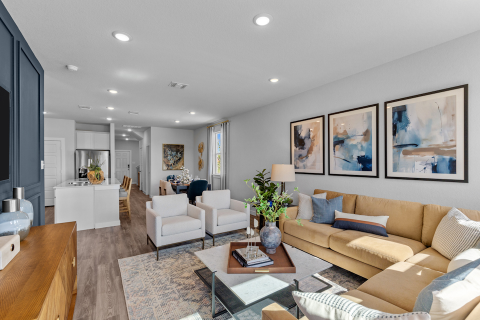 A living room with a large rug and a couch.