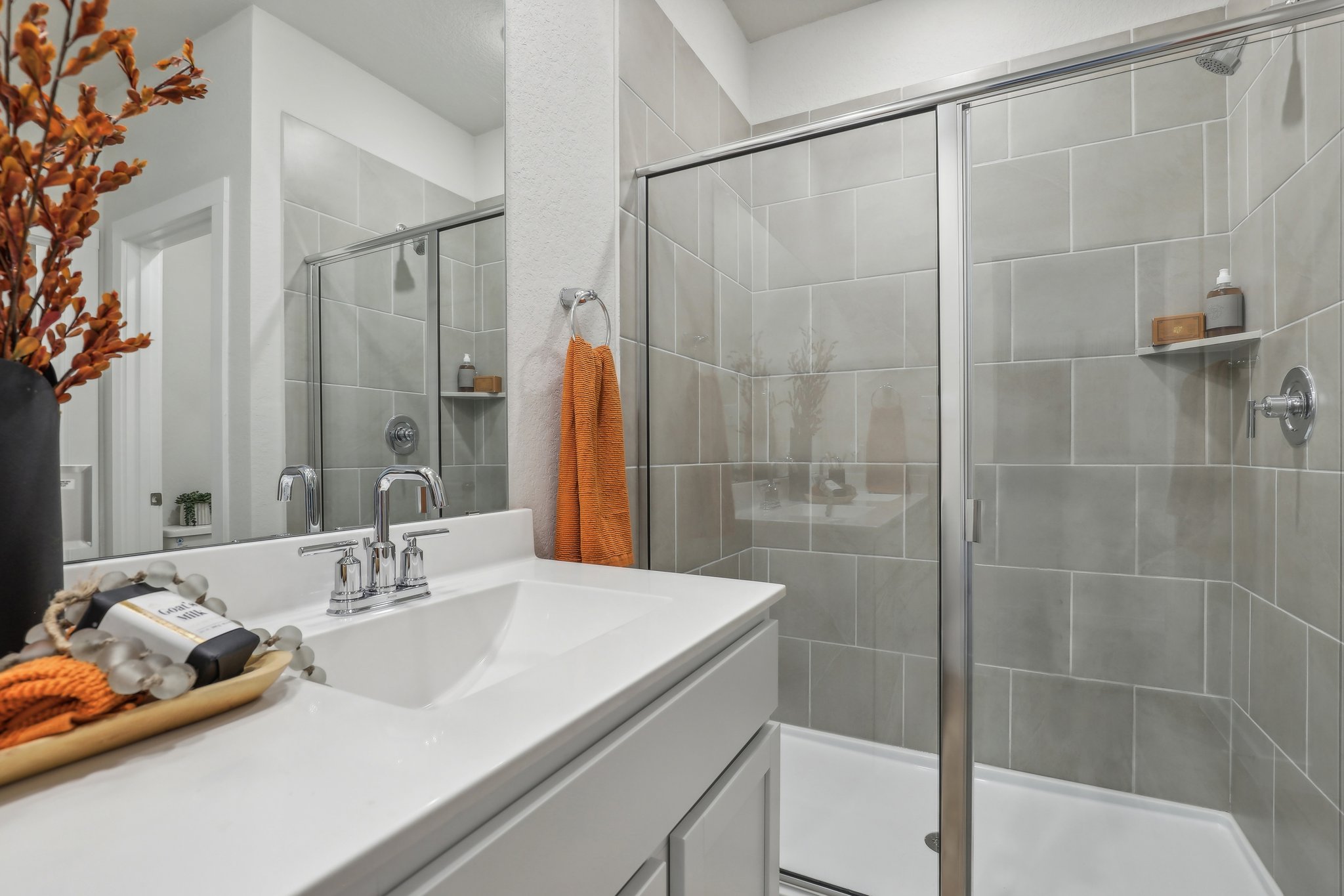 A bathroom with a glass shower.