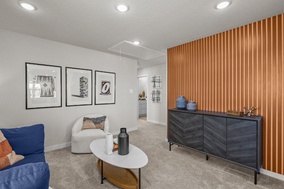 A living room with a couch and a table.