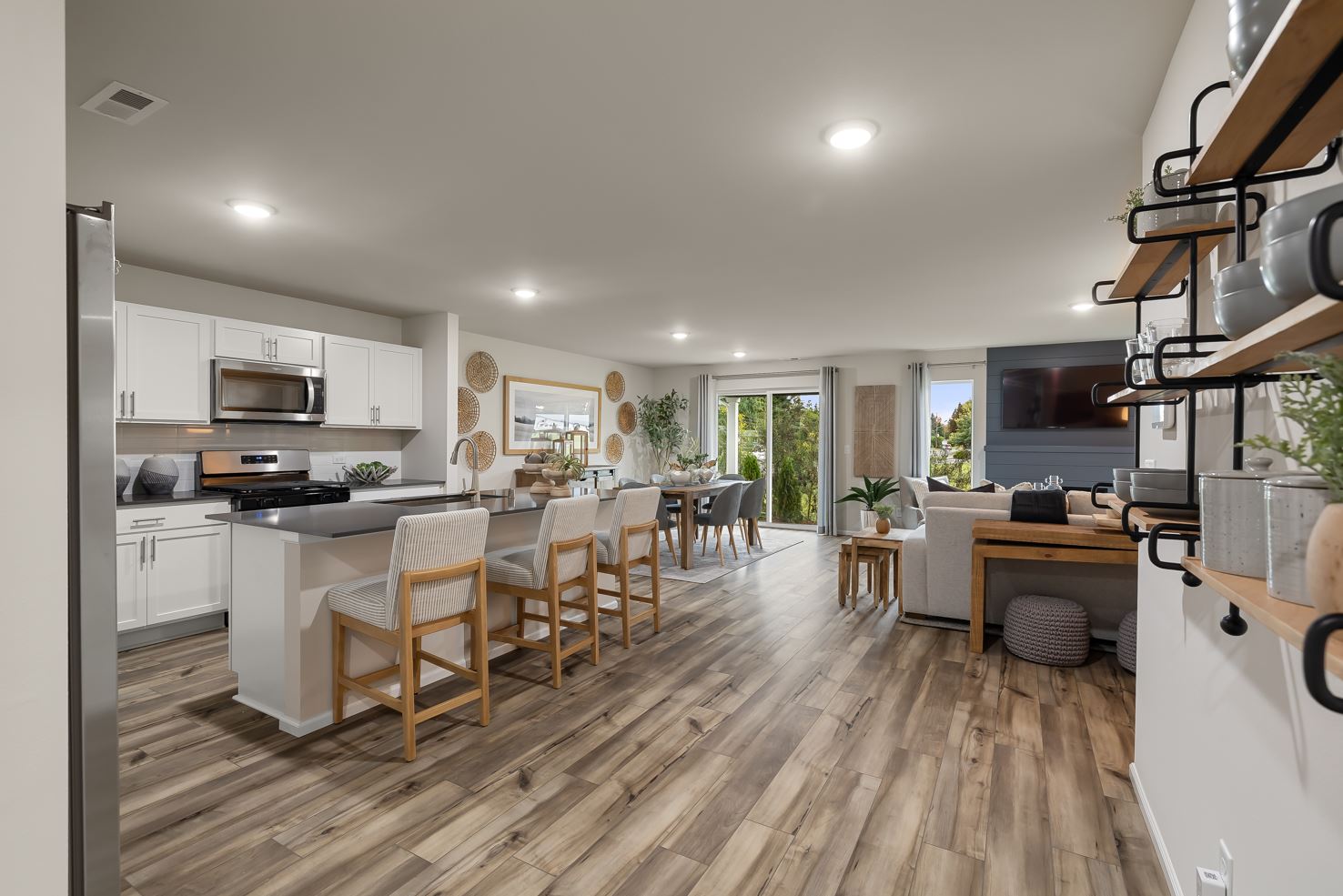 A kitchen with a wood floor.