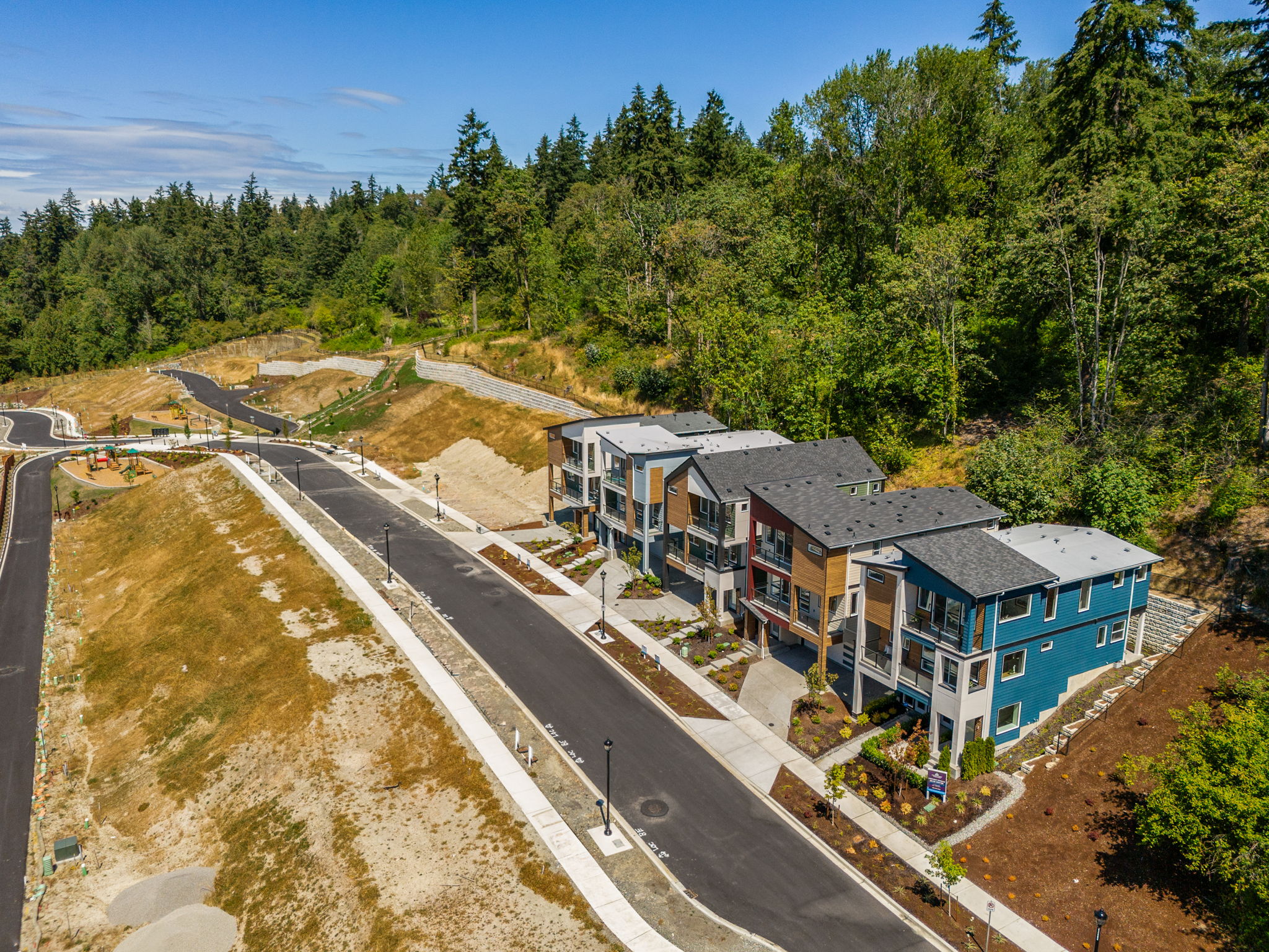 A group of houses next to a road.