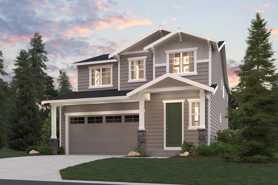 A house with a garage and trees around it.