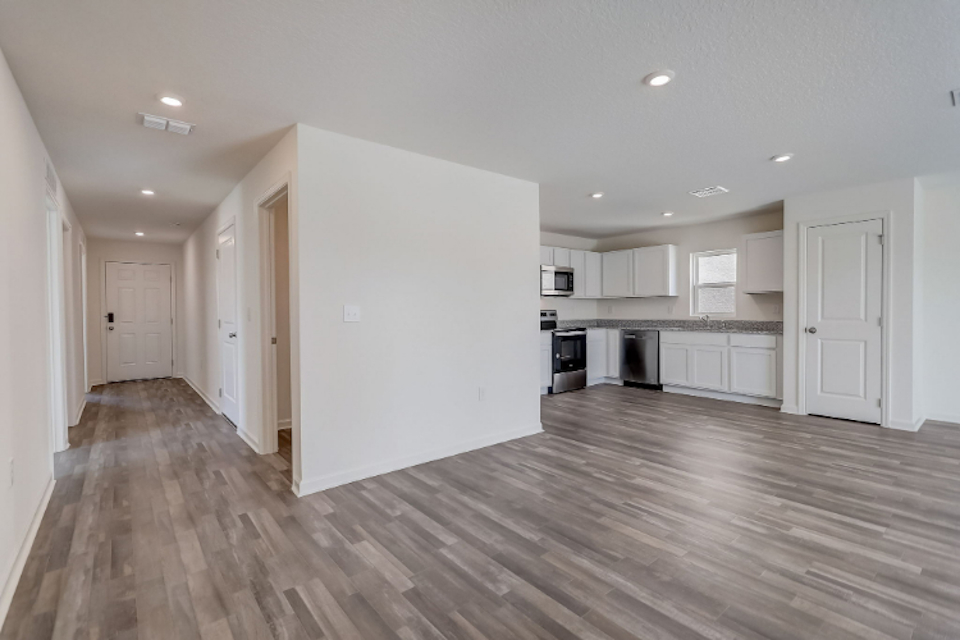A large kitchen with white cabinets.