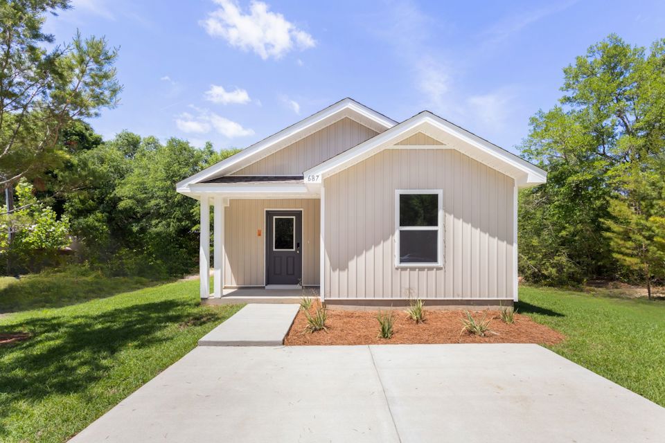 A small building with a small garage.