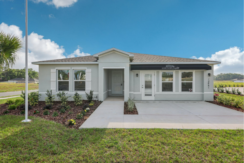 A white house with a driveway.