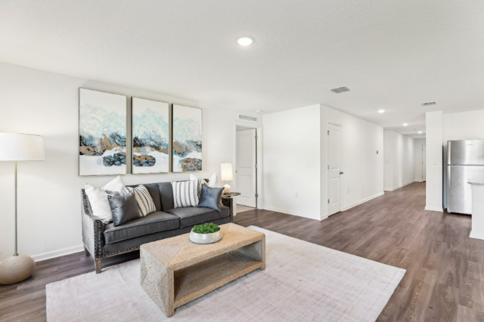 A living room with a couch and a coffee table.