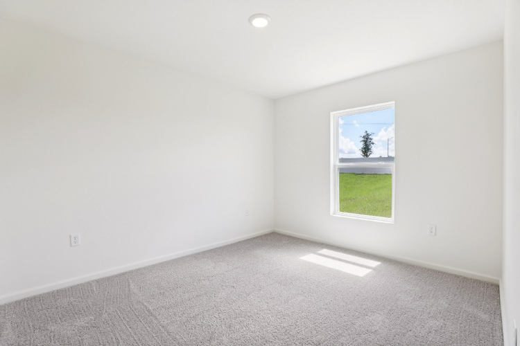 A room with a window and a door.