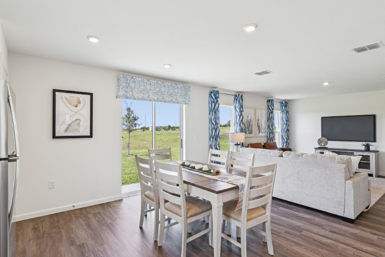 A room with a table and chairs.