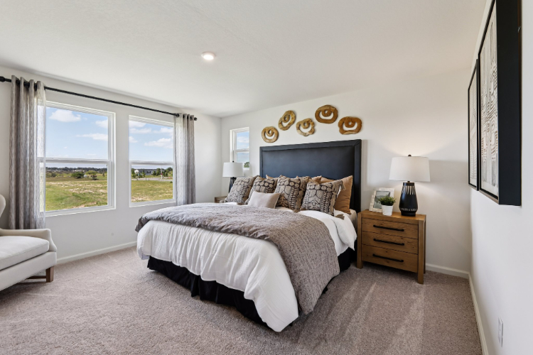 A bedroom with a large bed.