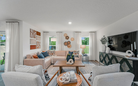 A living room with a couch and a coffee table.