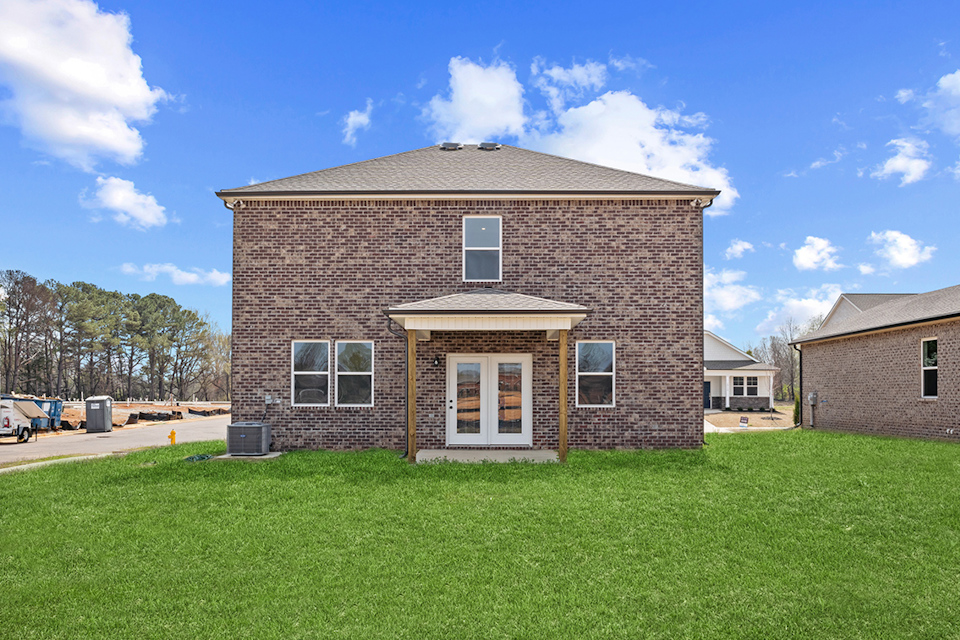 A brick house with a garage.
