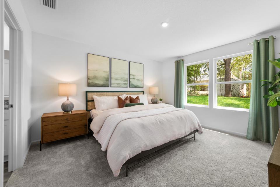 A bedroom with a large bed.