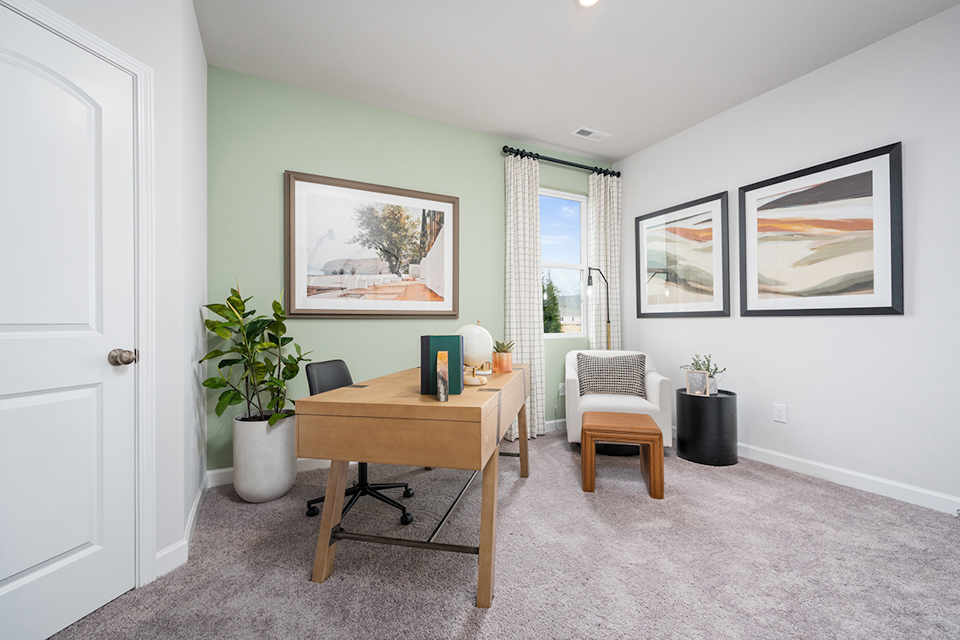 A room with a table and chairs.