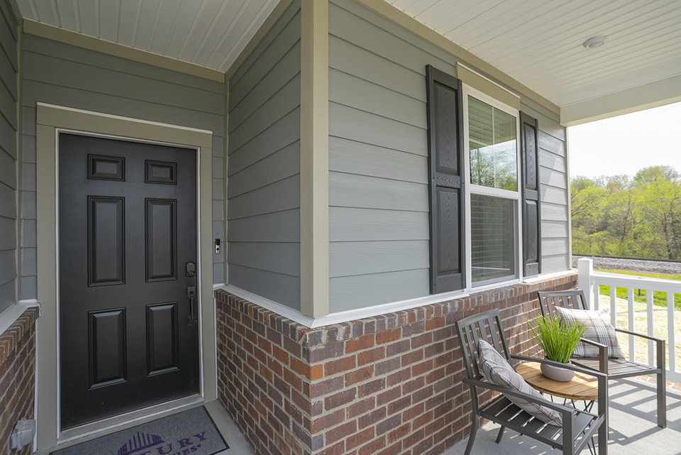 A patio with a table and chairs.
