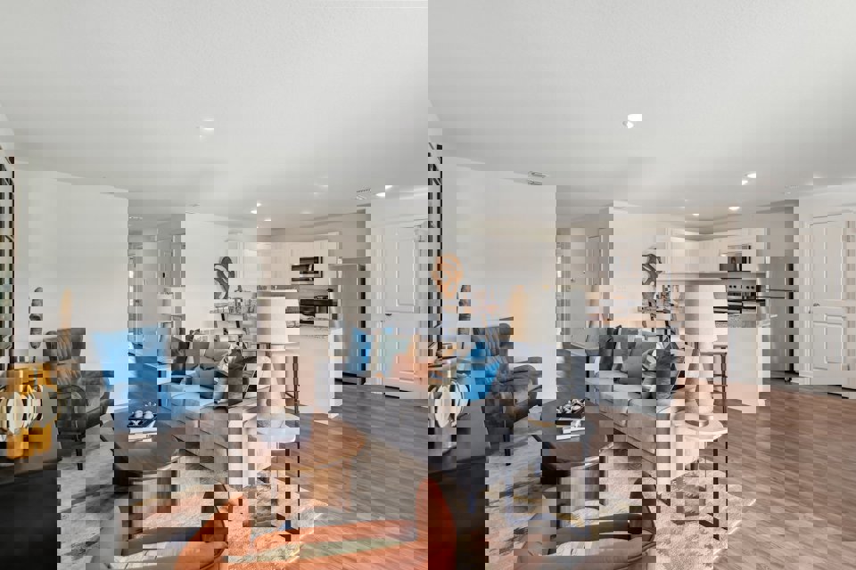 A living room with a wood floor.