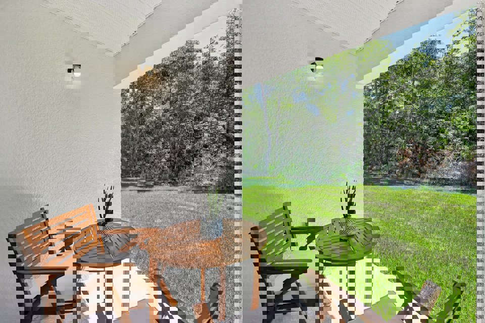 A table and chairs in a room.