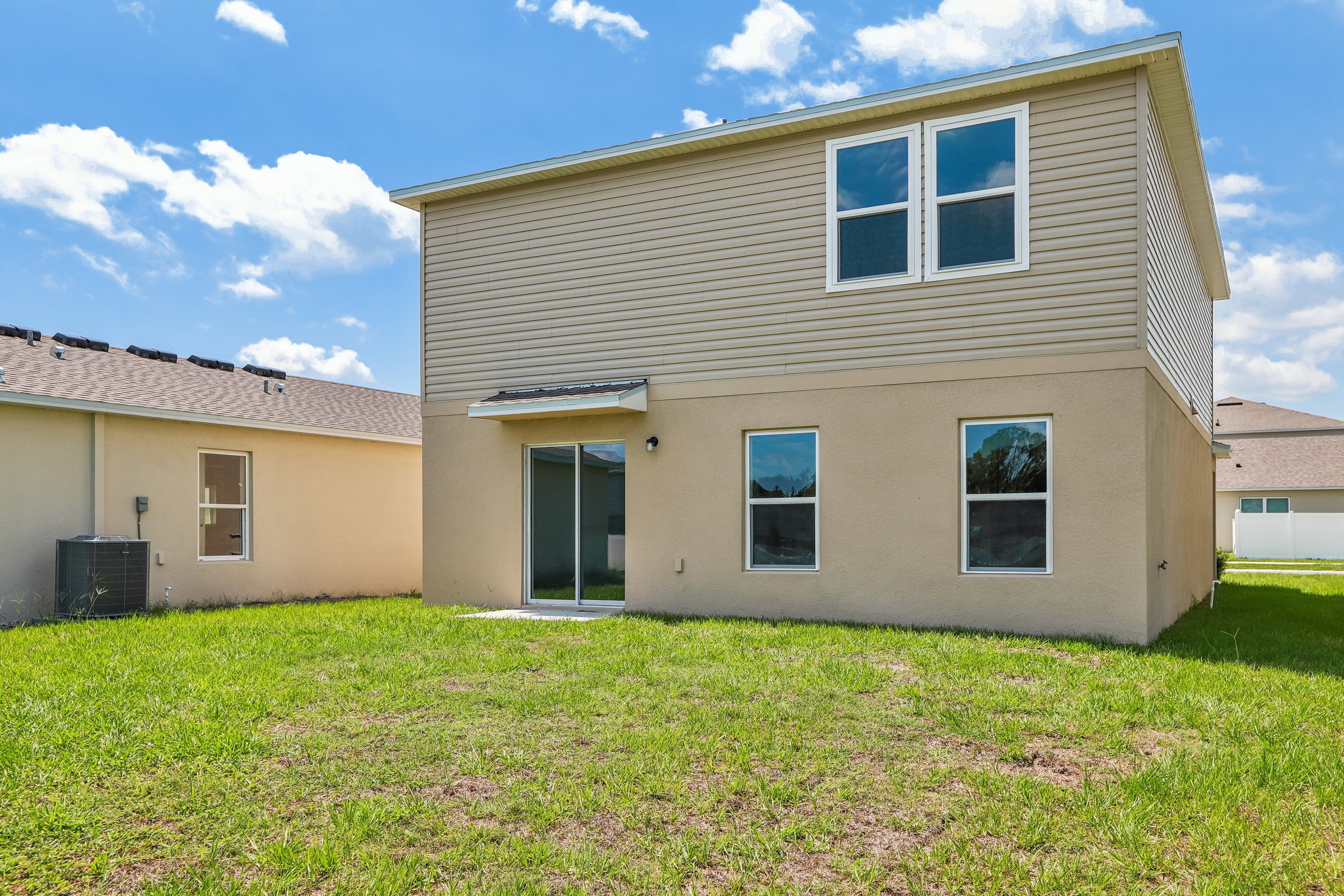 A house with a grass yard.
