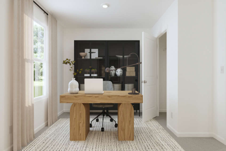 A room with a table and a mirror.