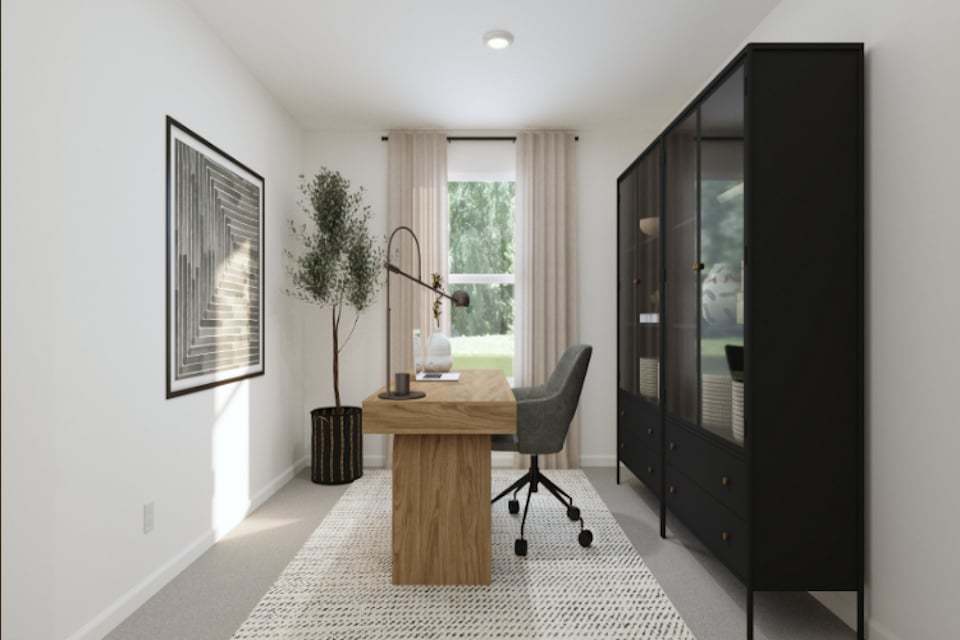 A room with a desk and a chair.