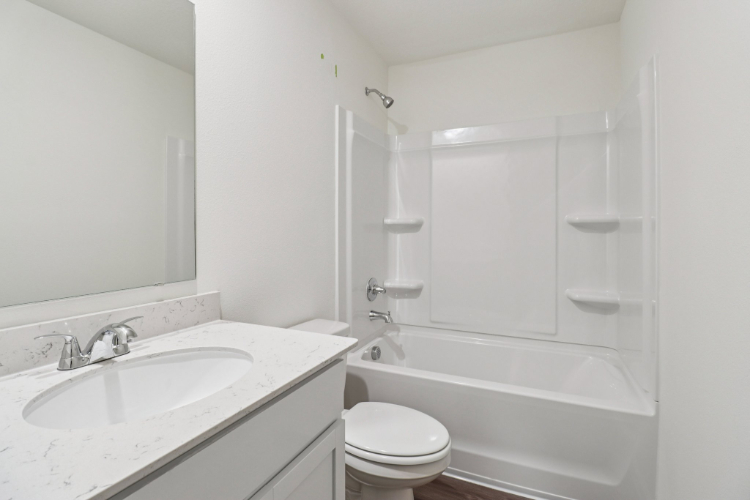 A bathroom with a sink and a bathtub.