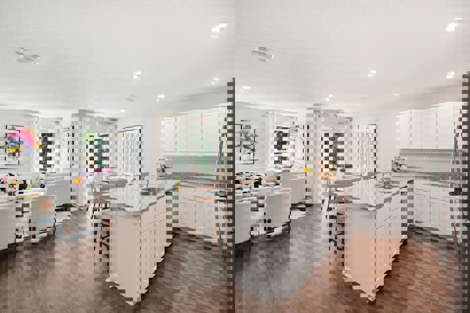 A kitchen with white cabinets.