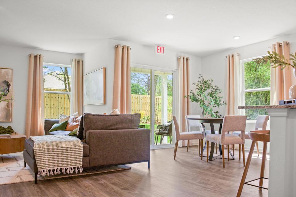 A living room with a wood floor.