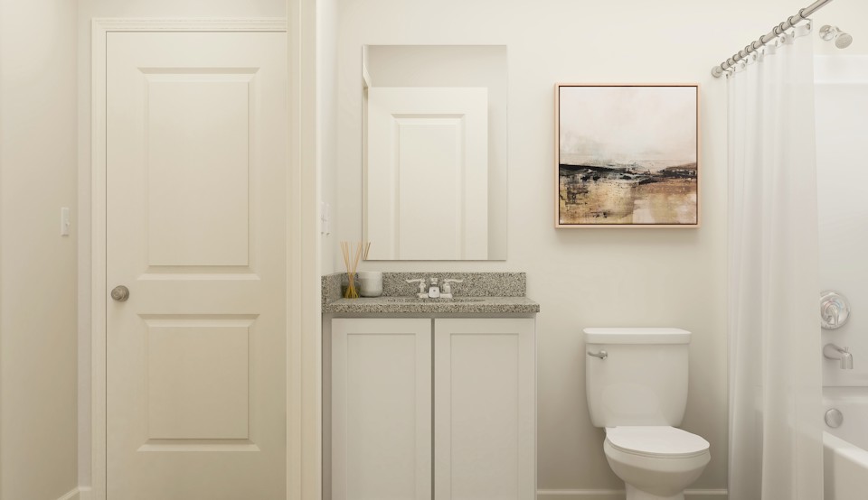 A bathroom with a toilet and sink.