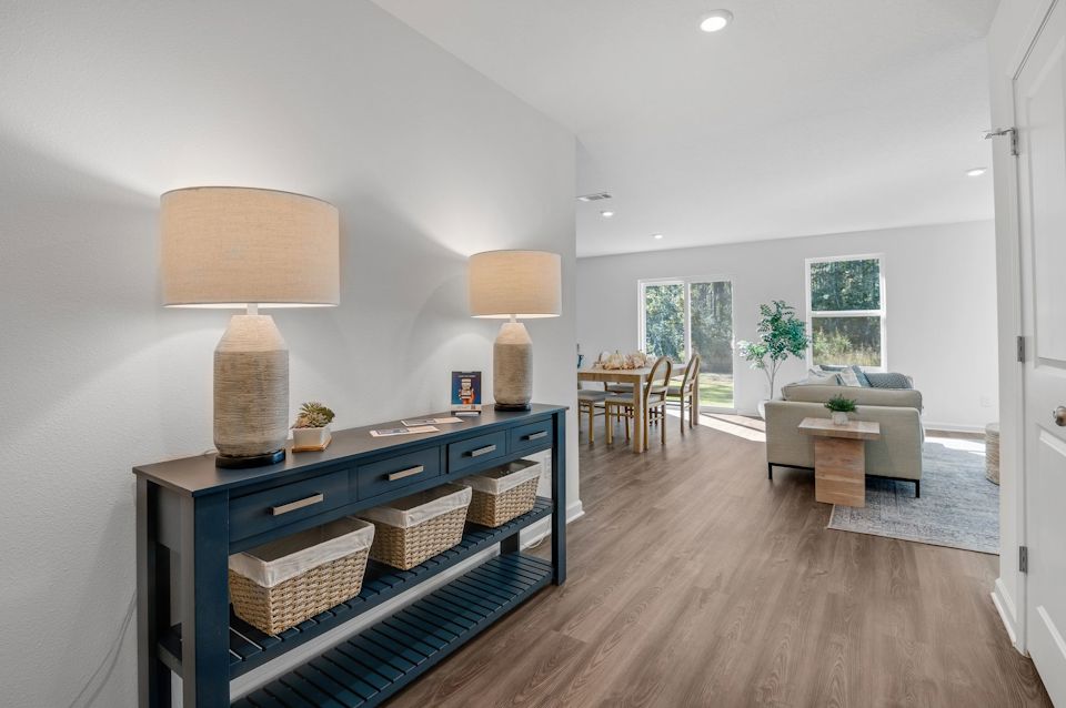 A living room with a wood floor.