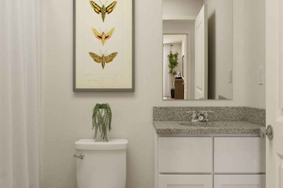A bathroom with a marble countertop.