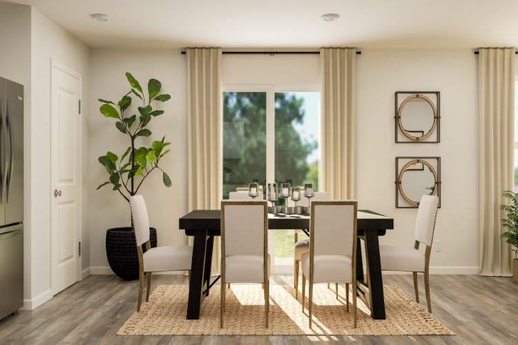 A dining room with a table and chairs.