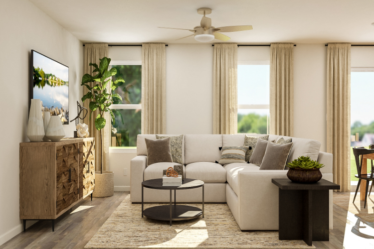 A living room with a white couch and a table.