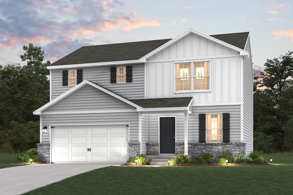 A white house with a garage.