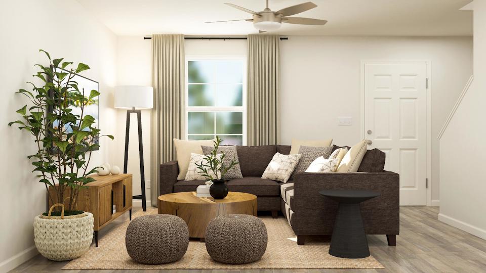 A living room with a couch and a table.