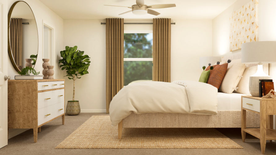 A bedroom with a bed and a fan.