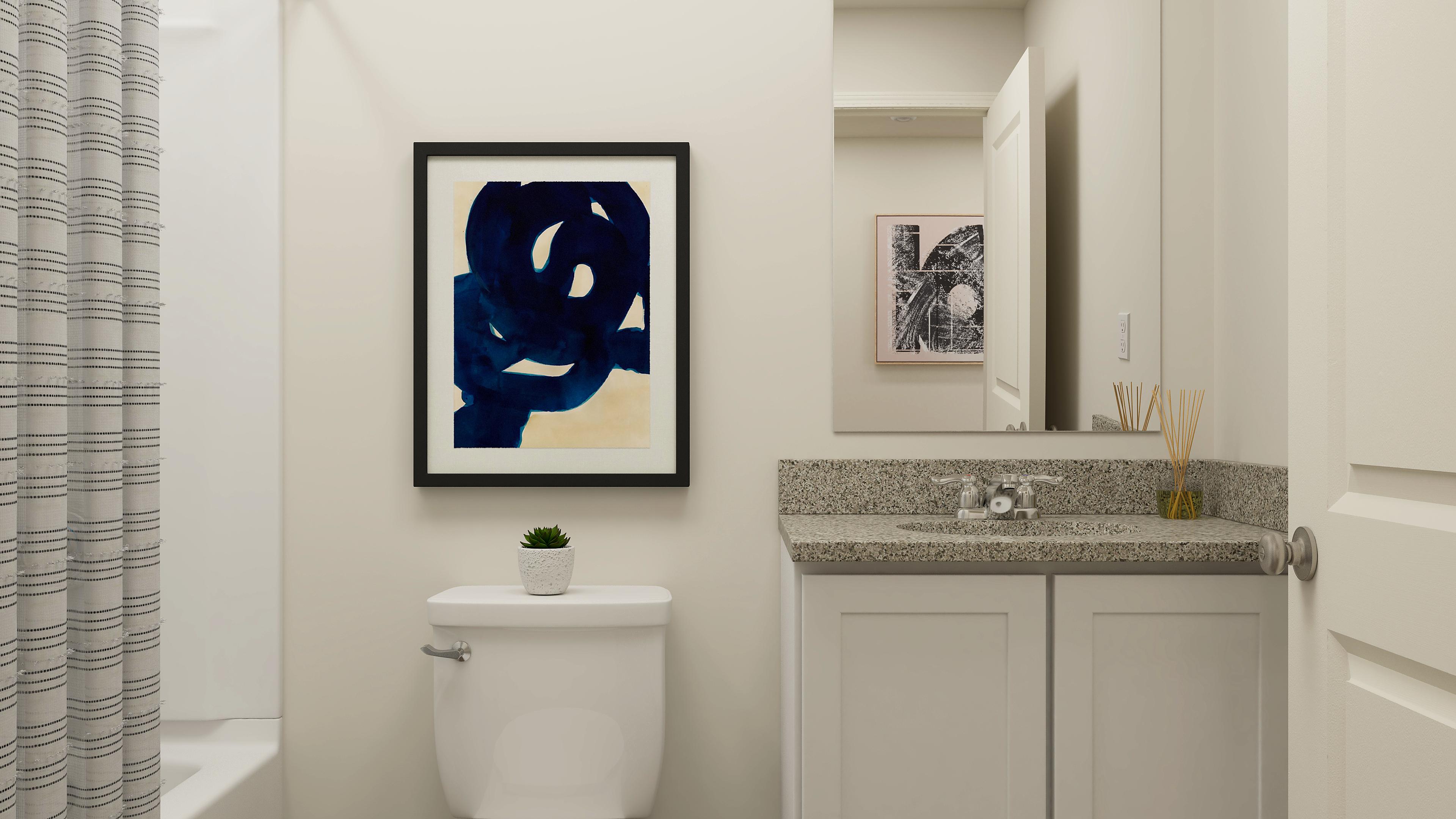 A bathroom with a sink and a toilet.