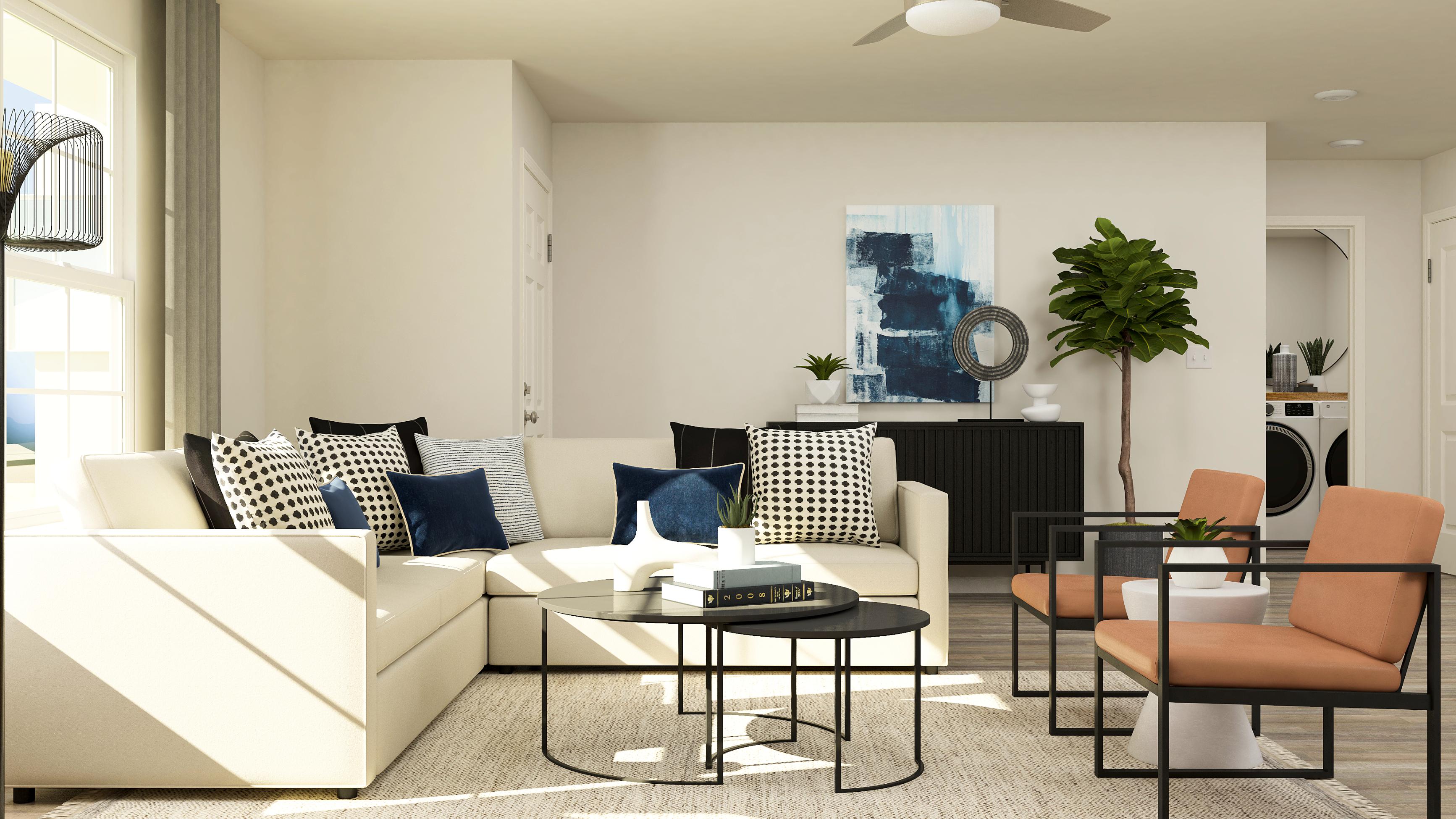 A living room with a white couch and a coffee table.