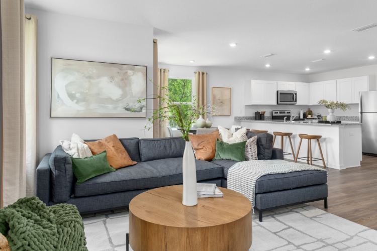A living room with a couch and coffee table.