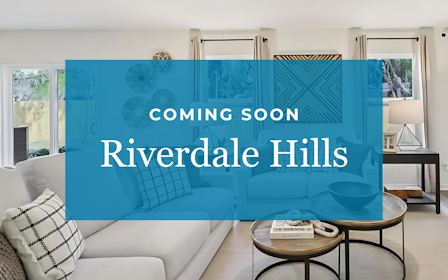 A room with a couch and a table.