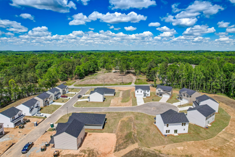 A group of houses and trees.