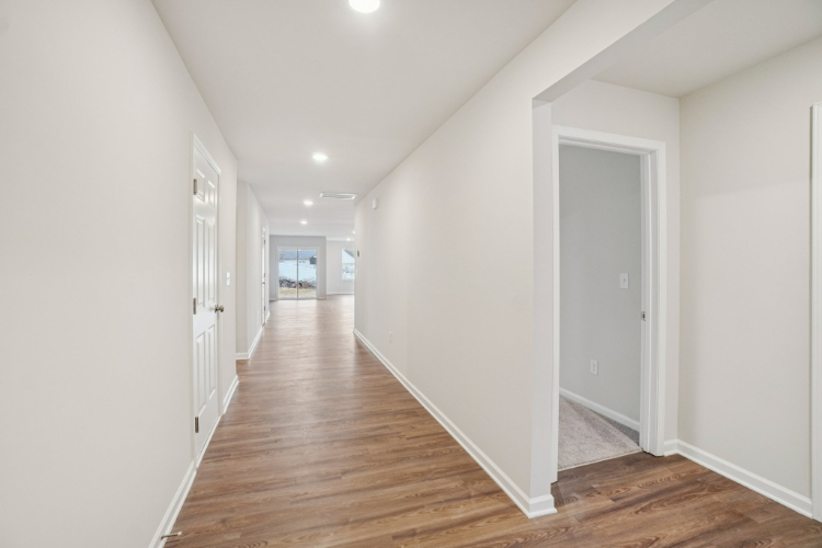 A hallway with white doors.